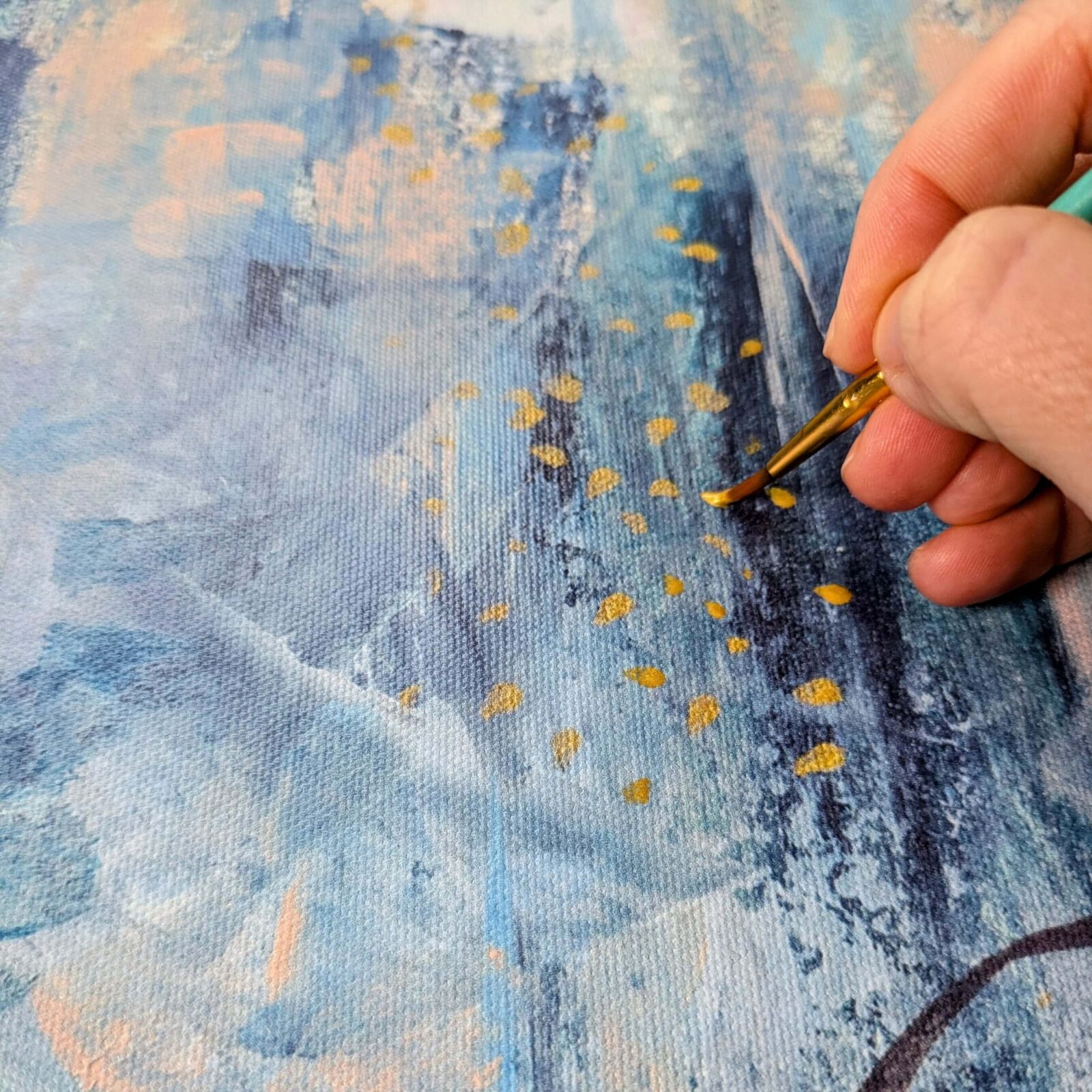 Hand-textured gold detailing on abstract canvas